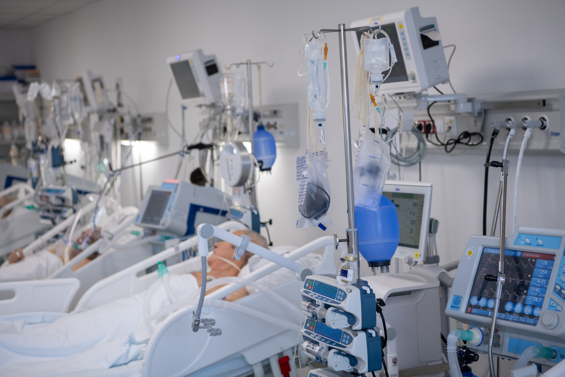 Nurse preparing IV medication in ICU